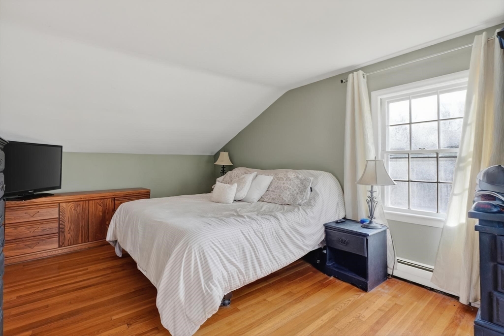21 Fairbanks Road Chelmsford, MA 01824 - Photo 15 of 29 a bedroom with a bed and a flat screen tv