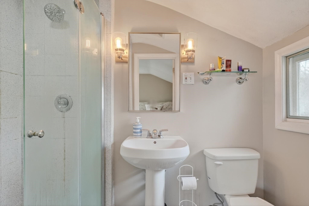 21 Fairbanks Road Chelmsford, MA 01824 - Photo 17 of 29 a bathroom with a toilet sink and mirror