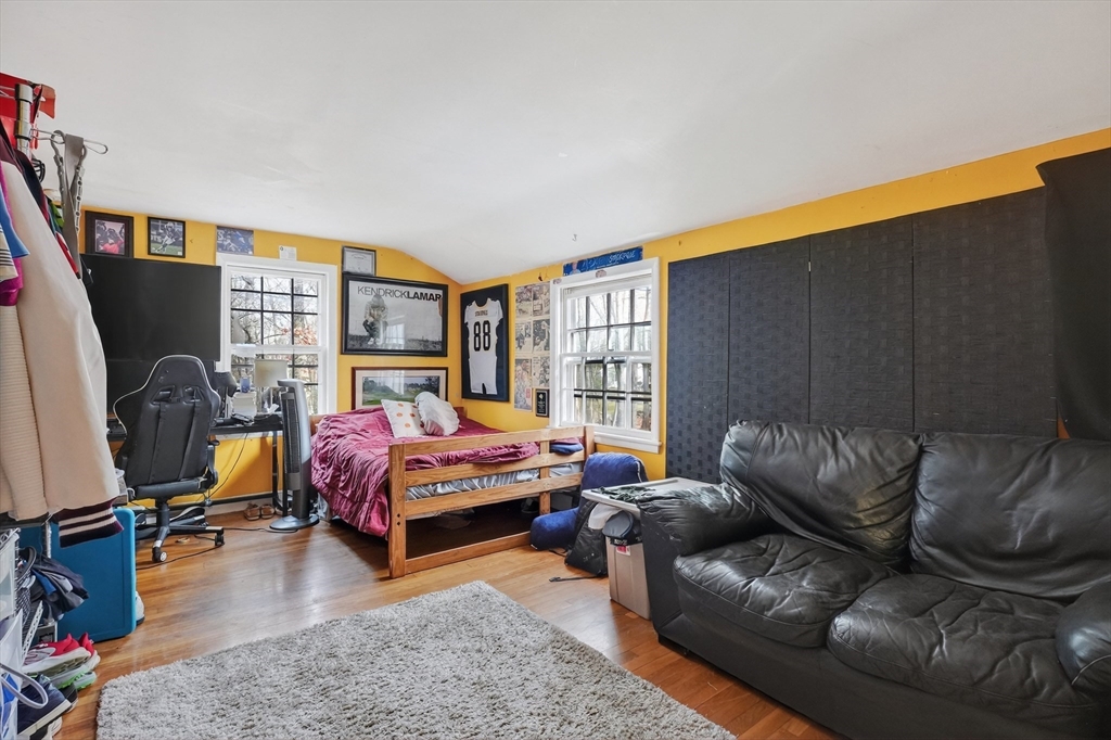 21 Fairbanks Road Chelmsford, MA 01824 - Photo 21 of 29 a living room with furniture flat screen tv and a large window