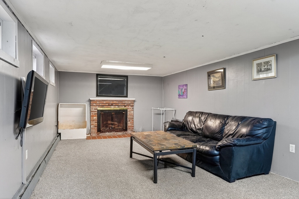 21 Fairbanks Road Chelmsford, MA 01824 - Photo 24 of 29 a living room with furniture and a fireplace