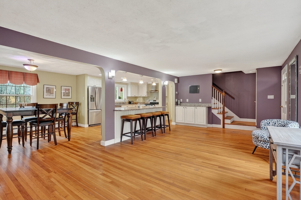 21 Fairbanks Road Chelmsford, MA 01824 - Photo 6 of 29 a living room with furniture and kitchen view with wooden floor