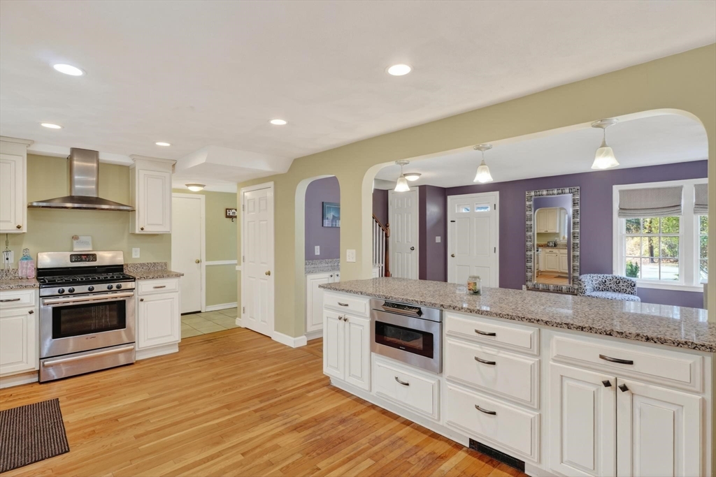 21 Fairbanks Road Chelmsford, MA 01824 - Photo 9 of 29 a kitchen with granite countertop a stove and a sink