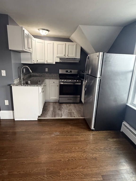 42 Mott Street, Unit 3 Fall River, MA 02721 - Photo 1 of 13 a kitchen with stainless steel appliances a refrigerator sink and stove
