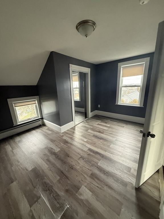 42 Mott Street, Unit 3 Fall River, MA 02721 - Photo 9 of 13 a view of an empty room and window and wooden floor
