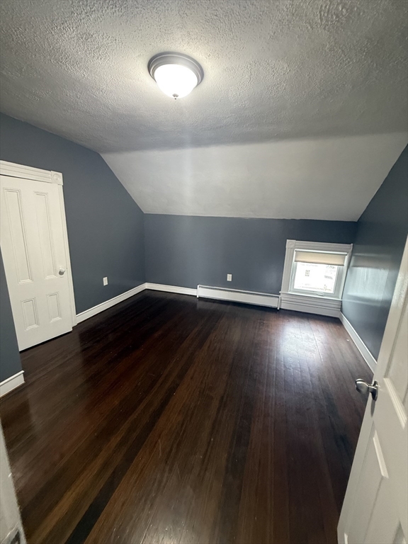 42 Mott Street, Unit 3 Fall River, MA 02721 - Photo 10 of 13 wooden floor in a hall with a window
