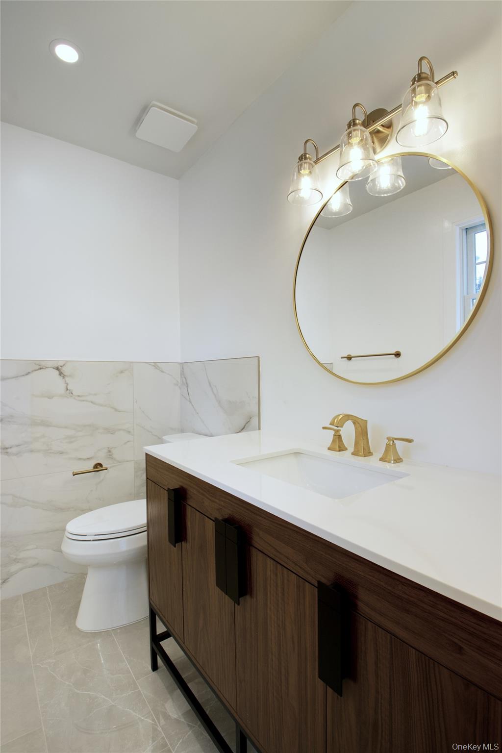 30 Kirkwood Road, Unit B Port Washington, NY 11050 - Photo 14 of 36 a bathroom with a sink and a mirror