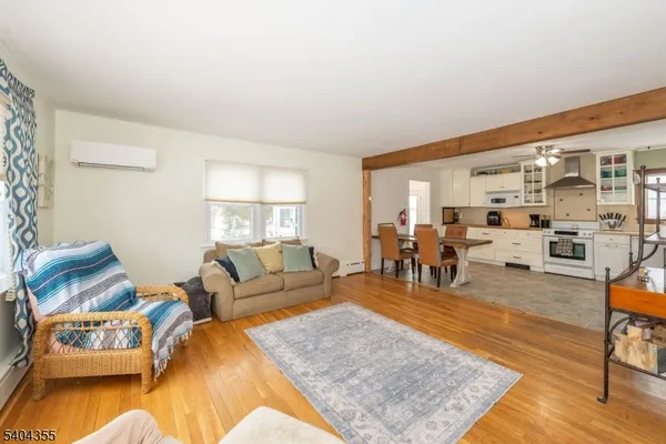 a living room with furniture rug and window