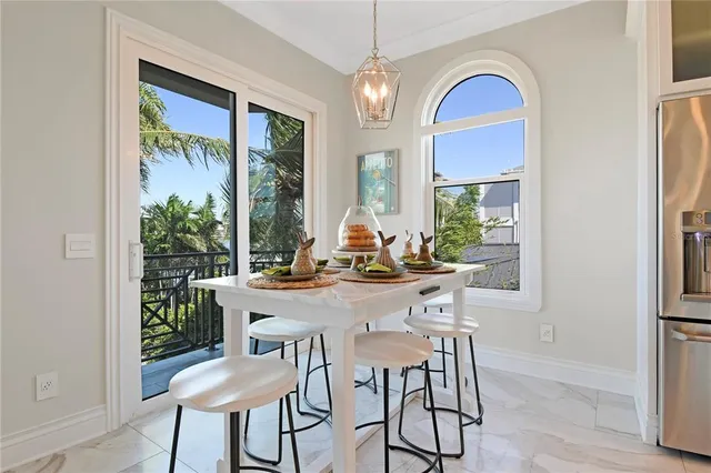 a bedroom with a bed and painting on the wall
