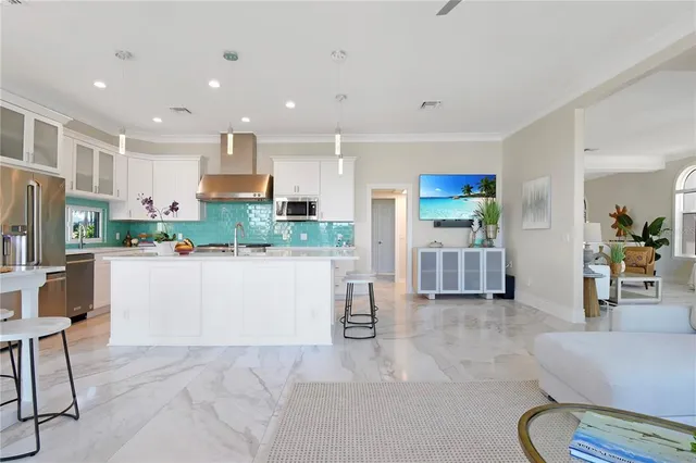 a bedroom with a bed a stove and a flat screen tv