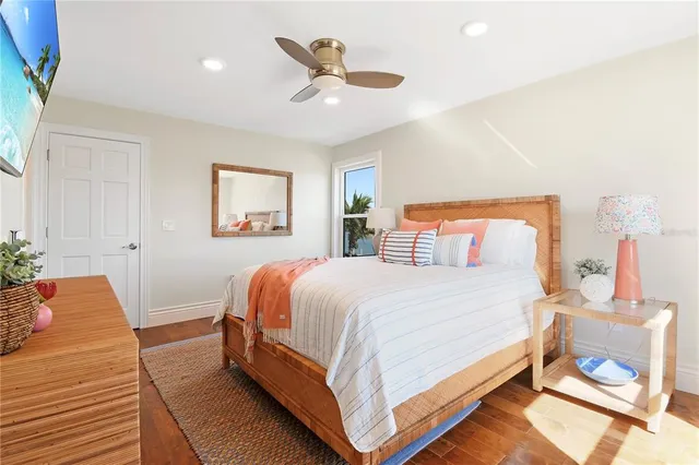 a bathroom with a toilet a sink a vanity and mirror