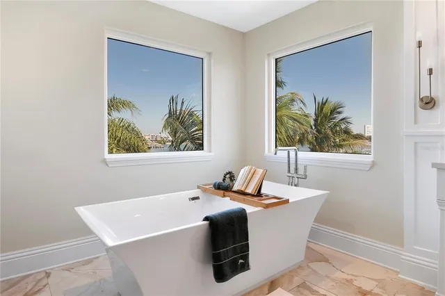 a view of two chairs in a balcony