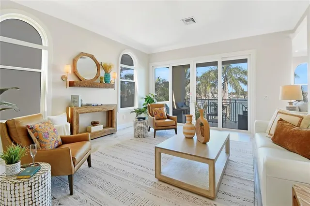 a kitchen with stainless steel appliances kitchen island a refrigerator sink and cabinets