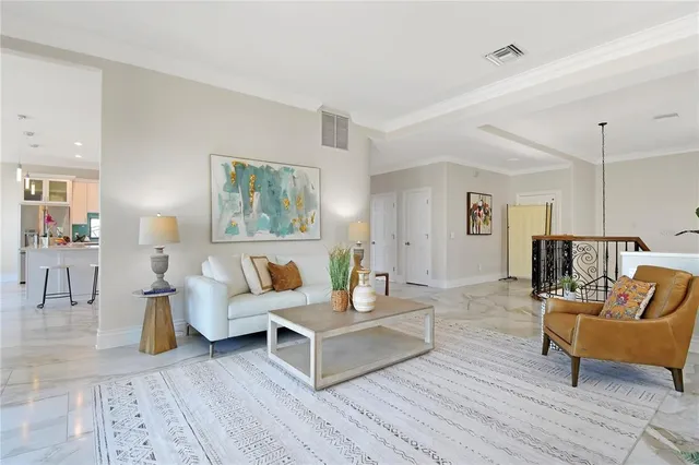a view of kitchen with kitchen island stainless steel appliances refrigerator stove a dining table and chairs