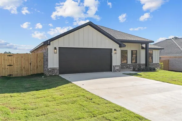 a front view of house with garage