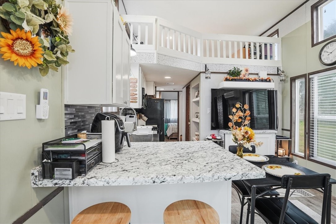 Undisclosed Address Rockport, TX 78382 - Photo 11 of 24 a kitchen with stainless steel appliances granite countertop a stove and a dining table