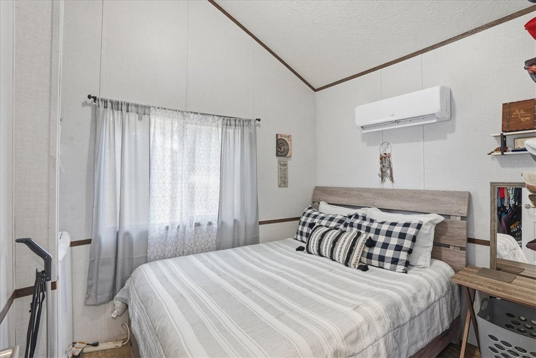 Undisclosed Address Rockport, TX 78382 - Photo 15 of 24 a bedroom with a bed and a table in it