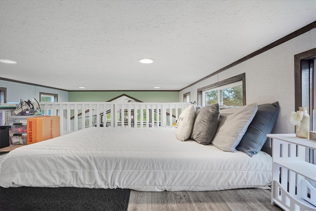 Undisclosed Address Rockport, TX 78382 - Photo 20 of 24 a bedroom with a large bed and a large window