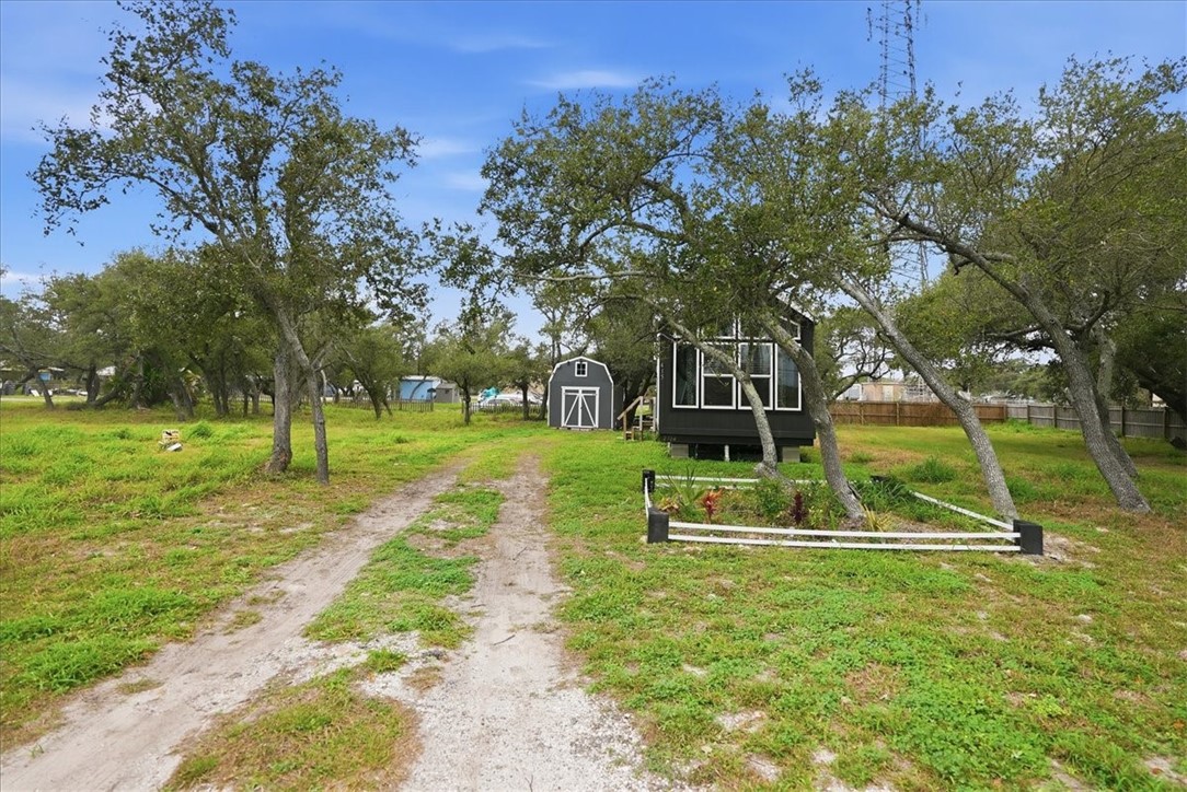 Undisclosed Address Rockport, TX 78382 - Photo 2 of 24 front view of a house with a yard