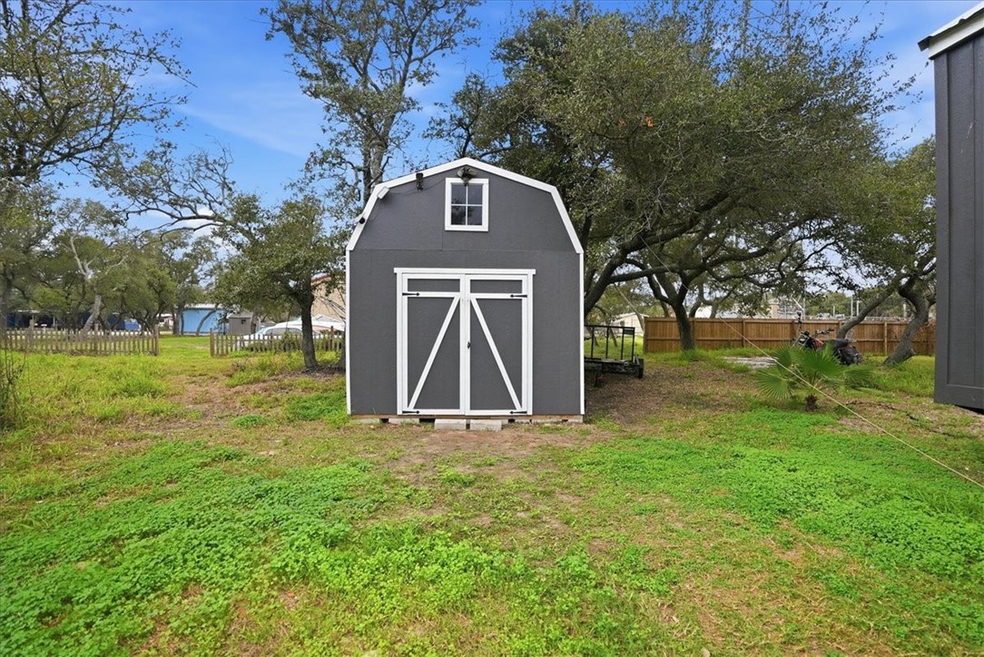 Undisclosed Address Rockport, TX 78382 - Photo 24 of 24 a front view of a house with garden