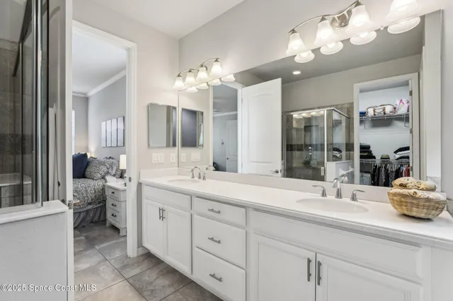 a bathroom with a sink double vanity and a mirror