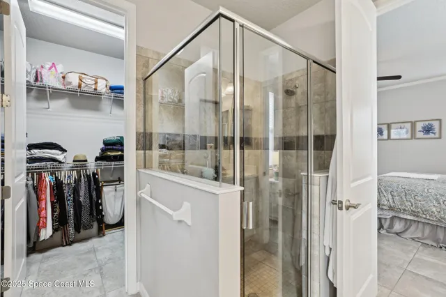 a view of a walk in closet and bathroom