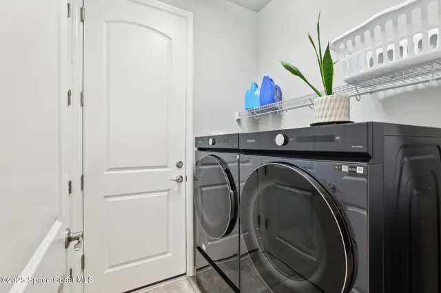 a utility room with dryer and washer