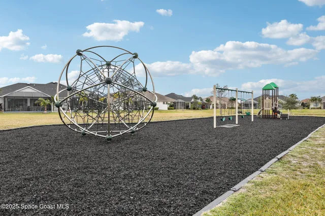 a view of a swimming pool with a yard