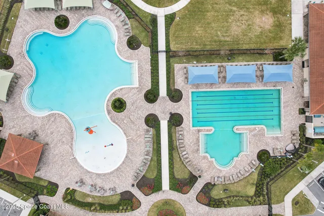 aerial view of a house with outdoor seating