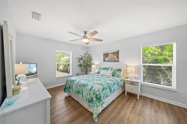 a living room with a bed furniture and a window