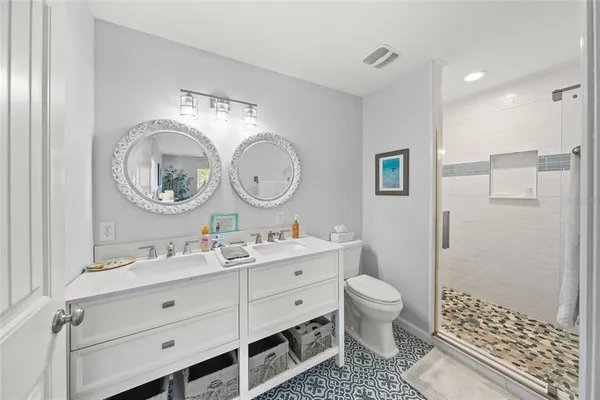 a bathroom with a shower and a sink