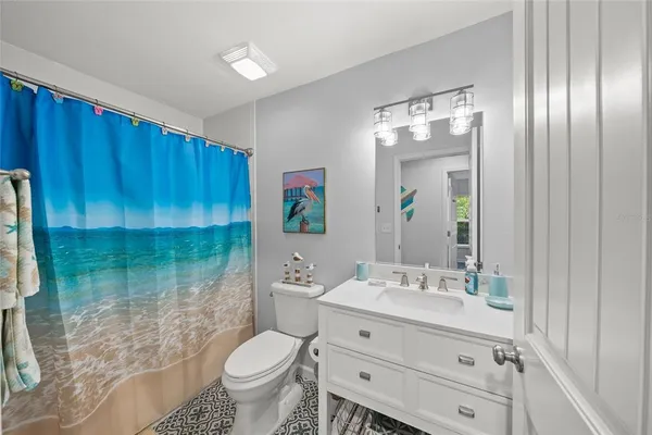 a utility room with stainless steel appliances wooden floor washer and dryer