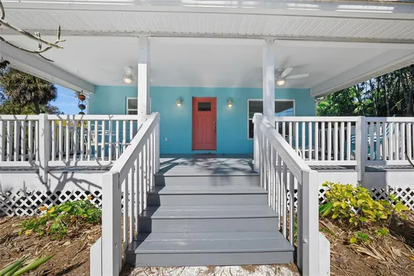 a view of balcony with wooden floor