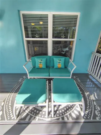 a view of a chairs and table on the deck