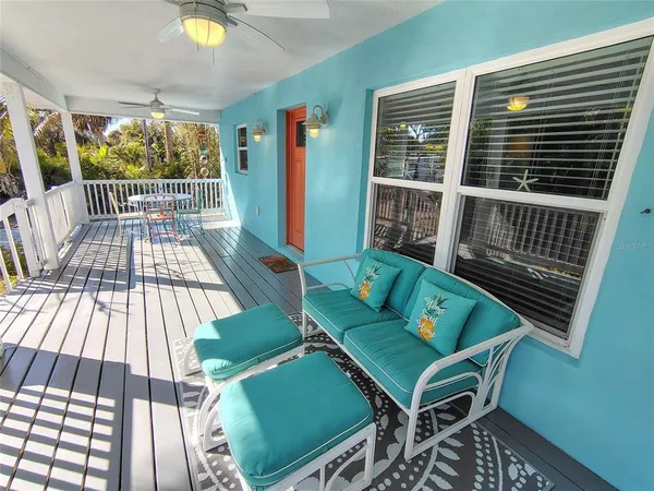 a view of a balcony with furniture