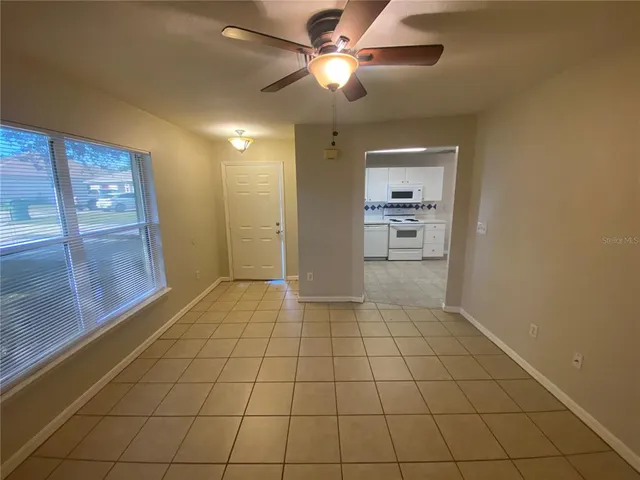 a view of an empty room and a window