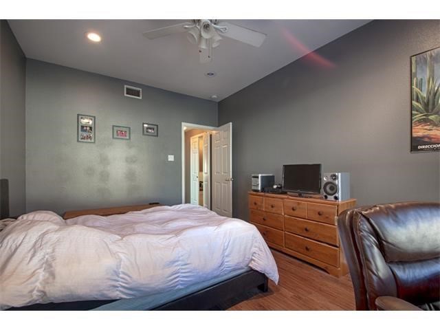 2529 Rio Grande Street, Unit 69 Austin, TX 78705 - Photo 14 of 25 a bedroom with a bed and furniture