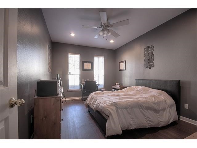 2529 Rio Grande Street, Unit 69 Austin, TX 78705 - Photo 16 of 25 a bedroom with a bed and a flat screen tv