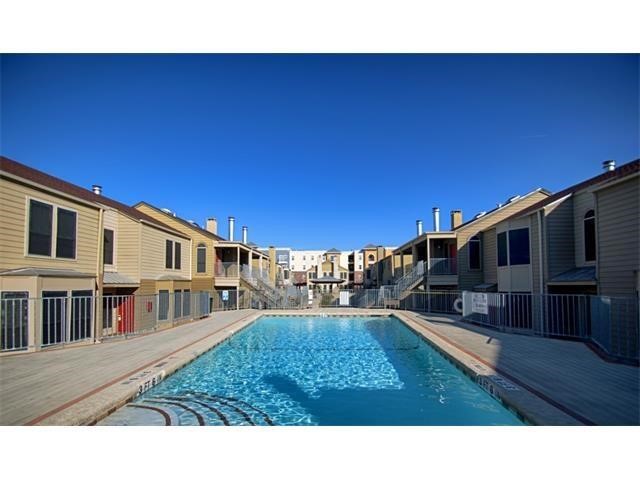 2529 Rio Grande Street, Unit 69 Austin, TX 78705 - Photo 25 of 25 a backyard of a house with table and chairs