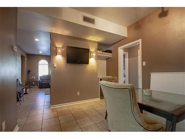 2529 Rio Grande Street, Unit 69 Austin, TX 78705 - Photo 6 of 25 a view of a livingroom with furniture and a flat screen tv