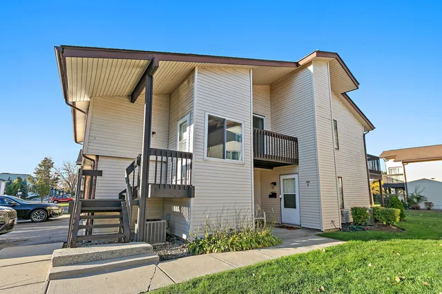 a view of a house with a yard and plants