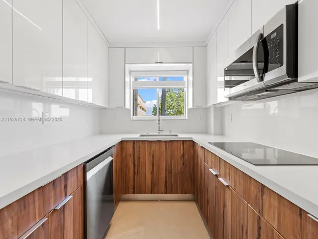 a view of a kitchen with furniture and window