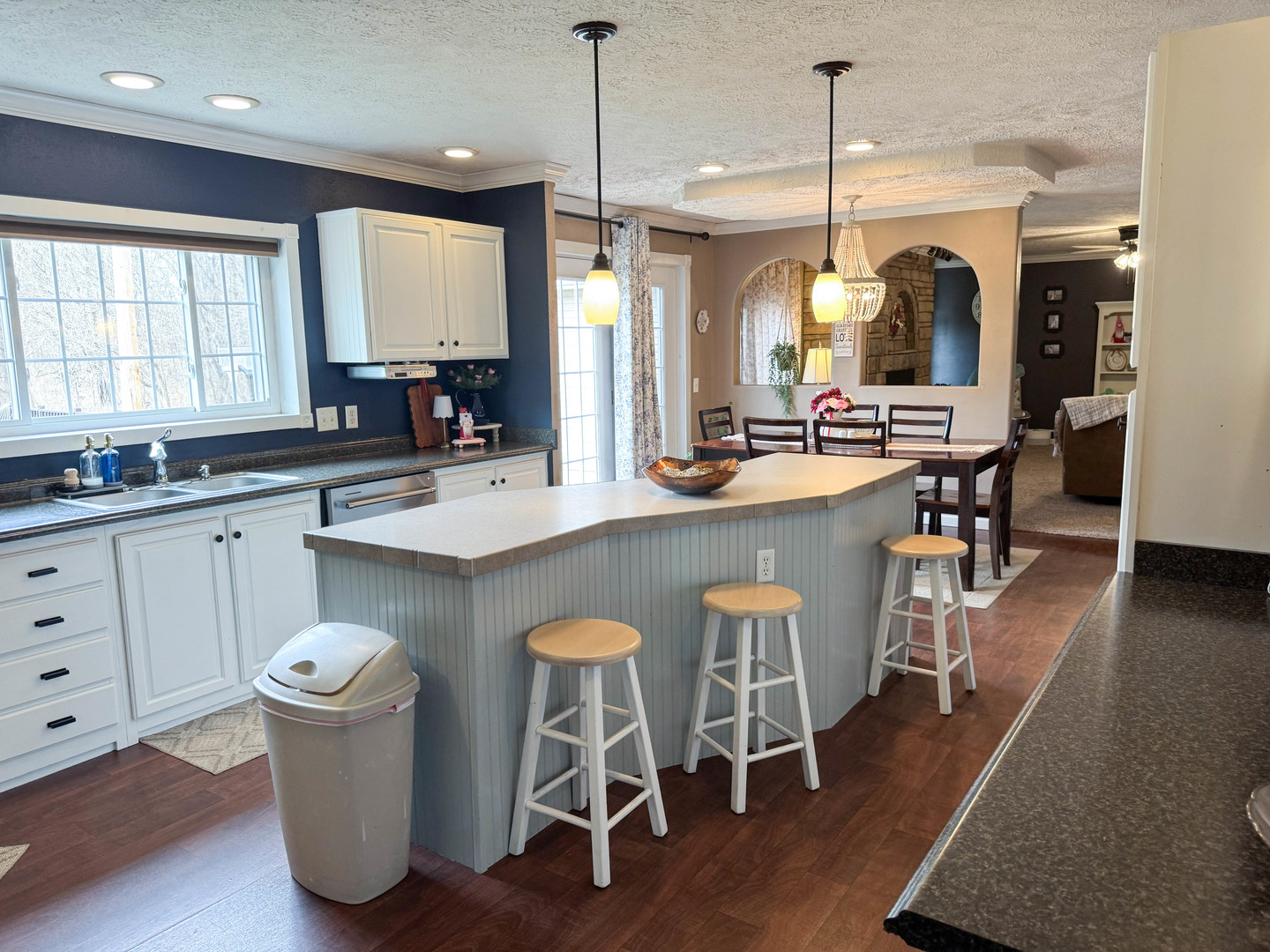 385 Toledo Cemetery Road Cobden, IL 62920 - Photo 23 of 38 a kitchen with a sink a stove a dining table and chairs