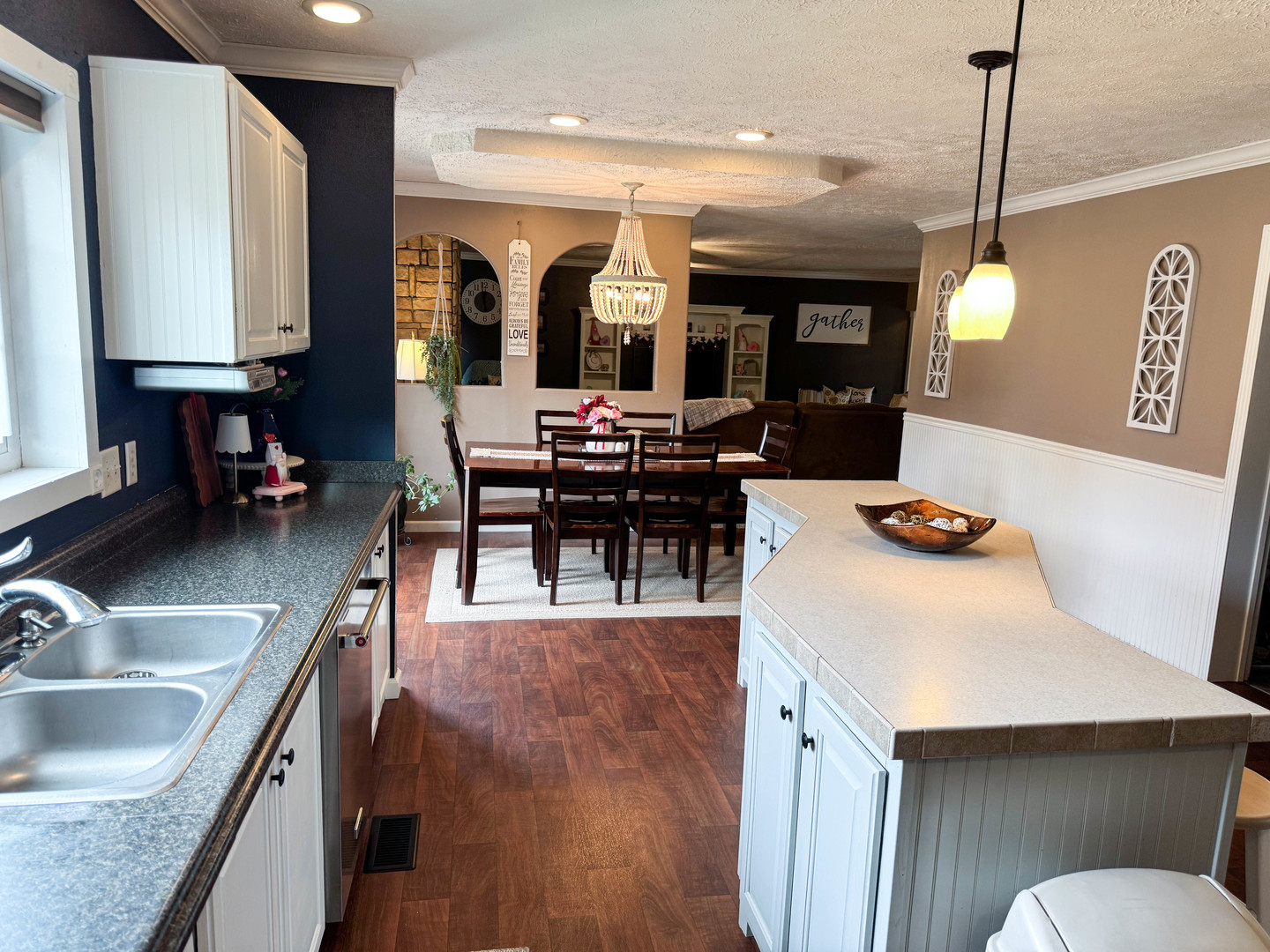 385 Toledo Cemetery Road Cobden, IL 62920 - Photo 24 of 38 a living room with furniture a chandelier and a large mirror on a dresser