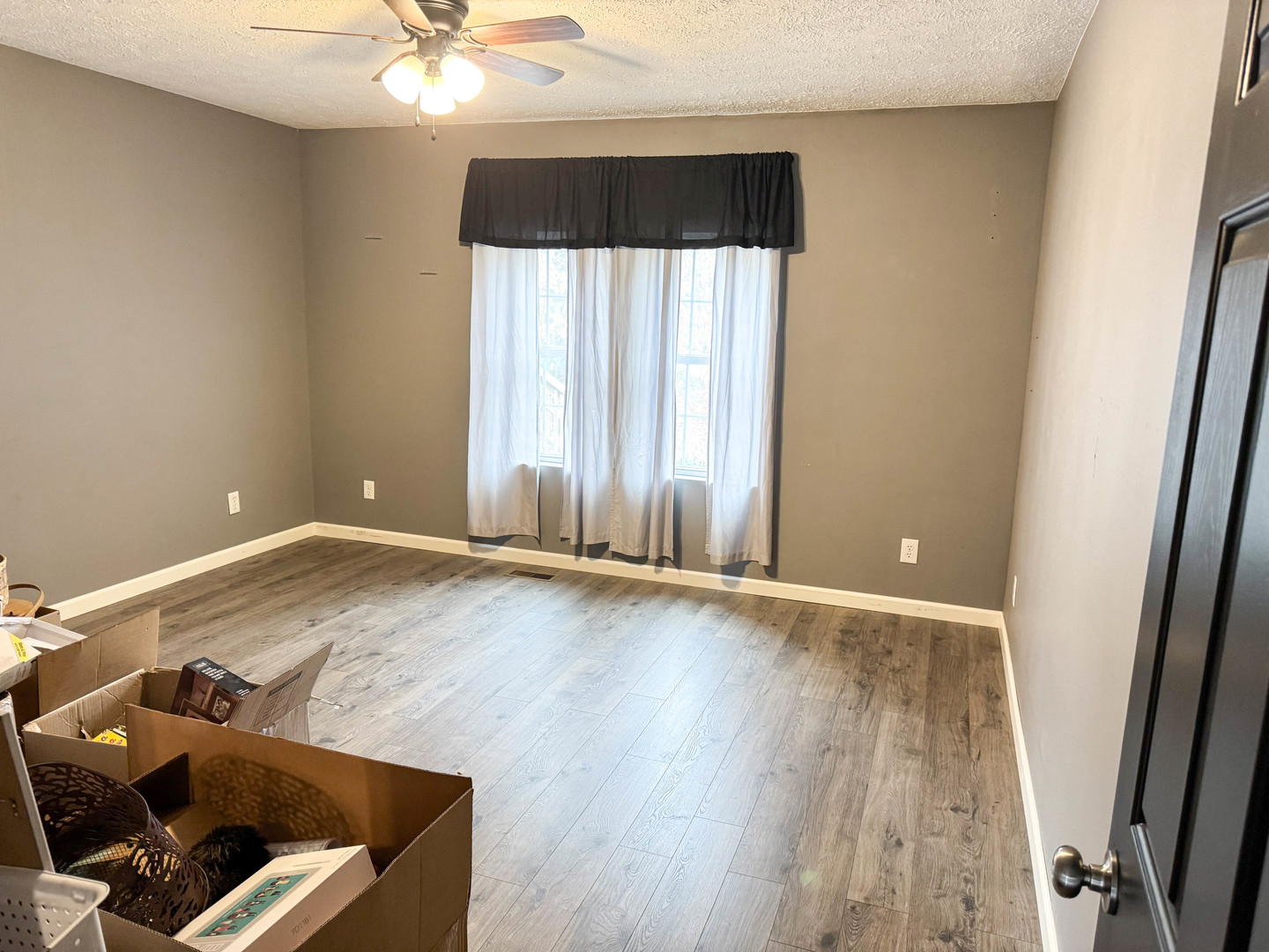 385 Toledo Cemetery Road Cobden, IL 62920 - Photo 35 of 38 an empty room with wooden floor and fan