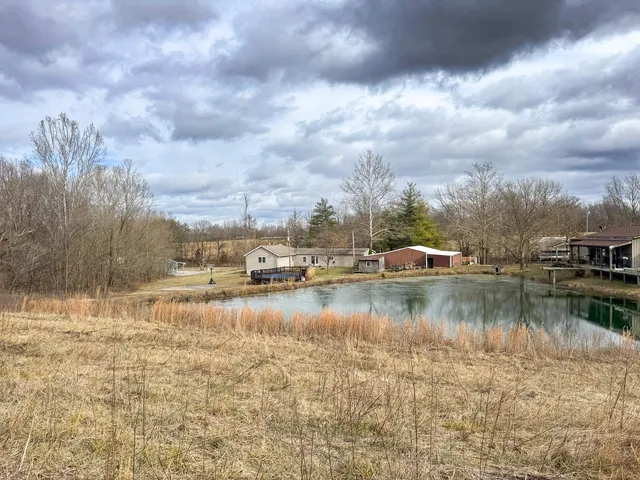 a view of a lake with houses in the background