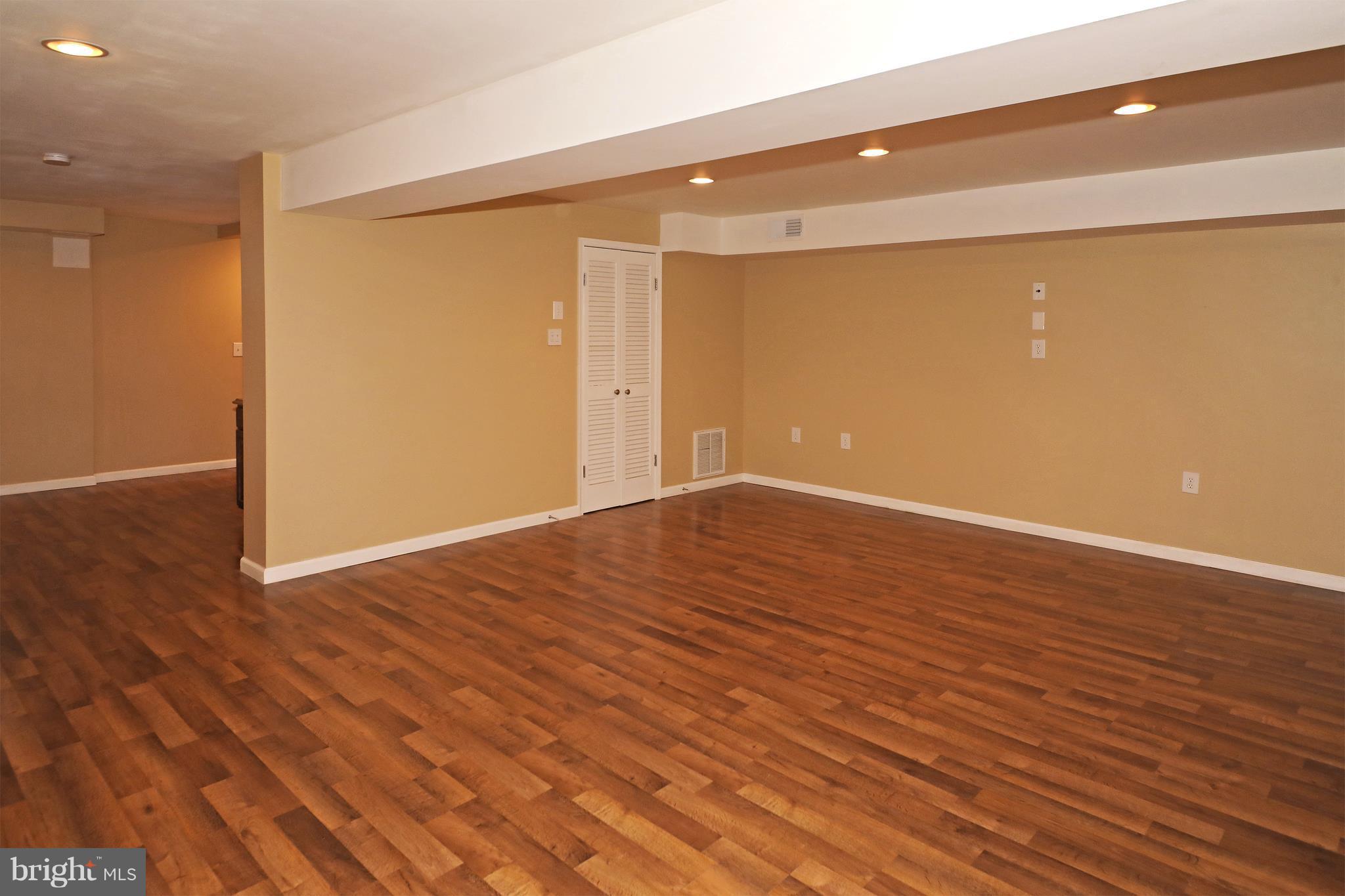 1810 Golf View Court Reston, VA 20190 - Photo 16 of 21 lower level recroom with laminate