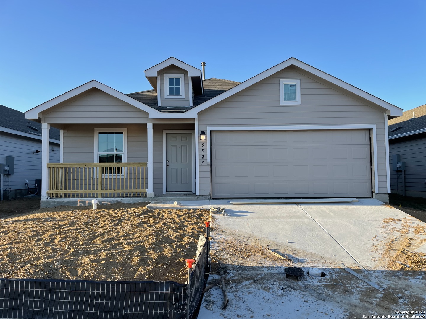 a front view of a house with garage