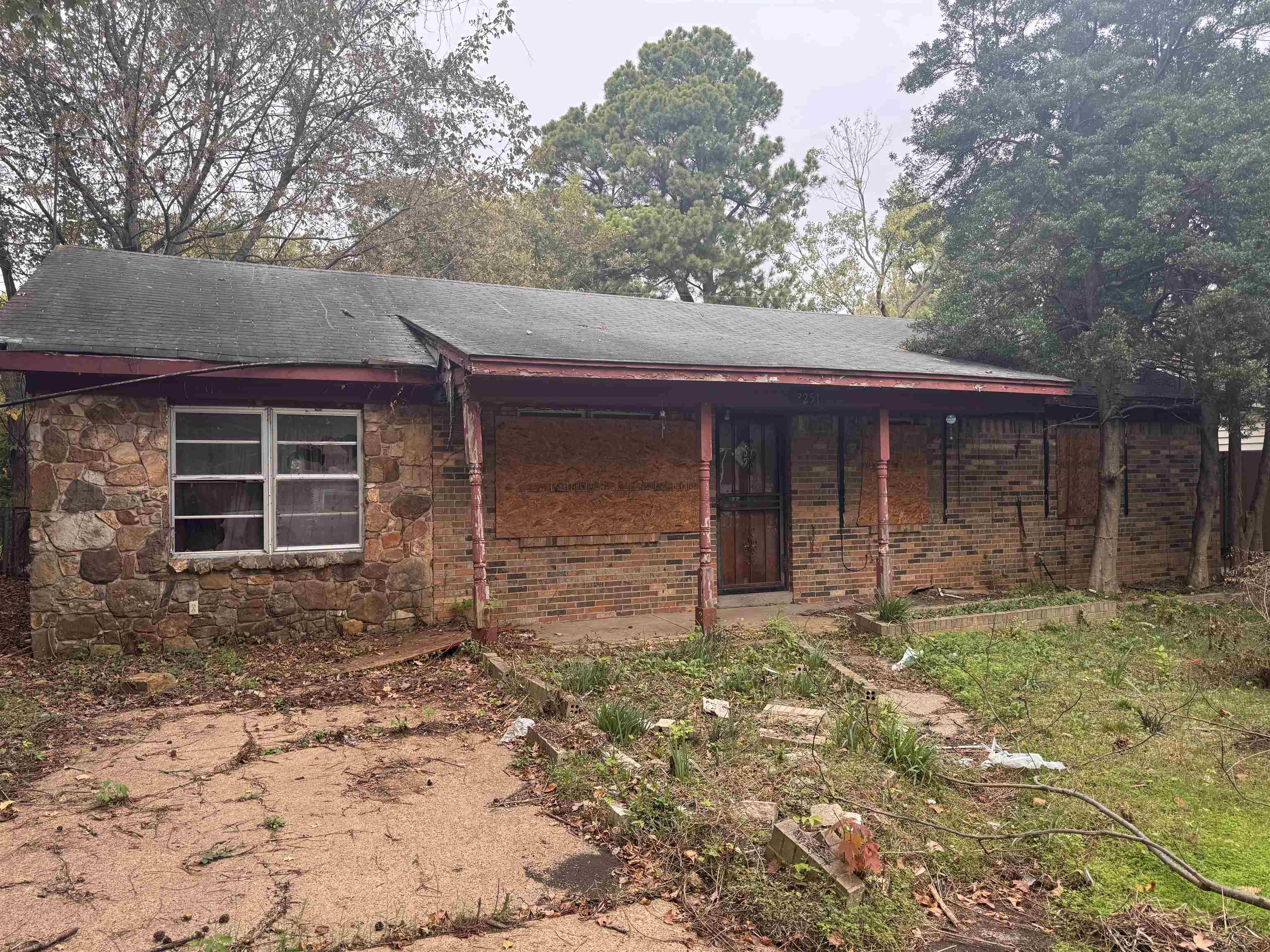 3251 Sinclair Street Memphis, TN 38127 - Photo 1 of 9 Back of house featuring stone siding and a porch