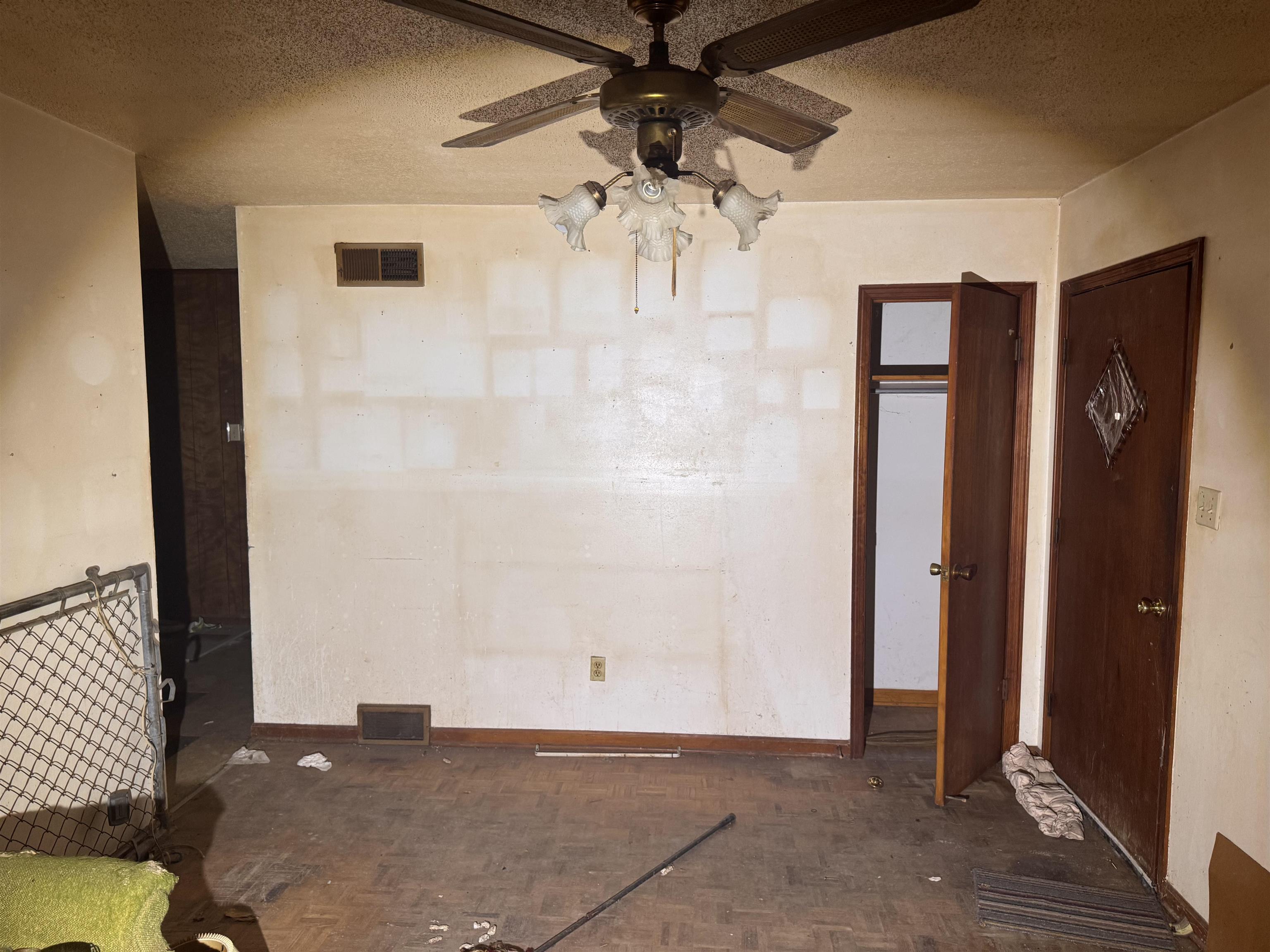 3251 Sinclair Street Memphis, TN 38127 - Photo 3 of 9 Empty room with a textured ceiling and a ceiling fan