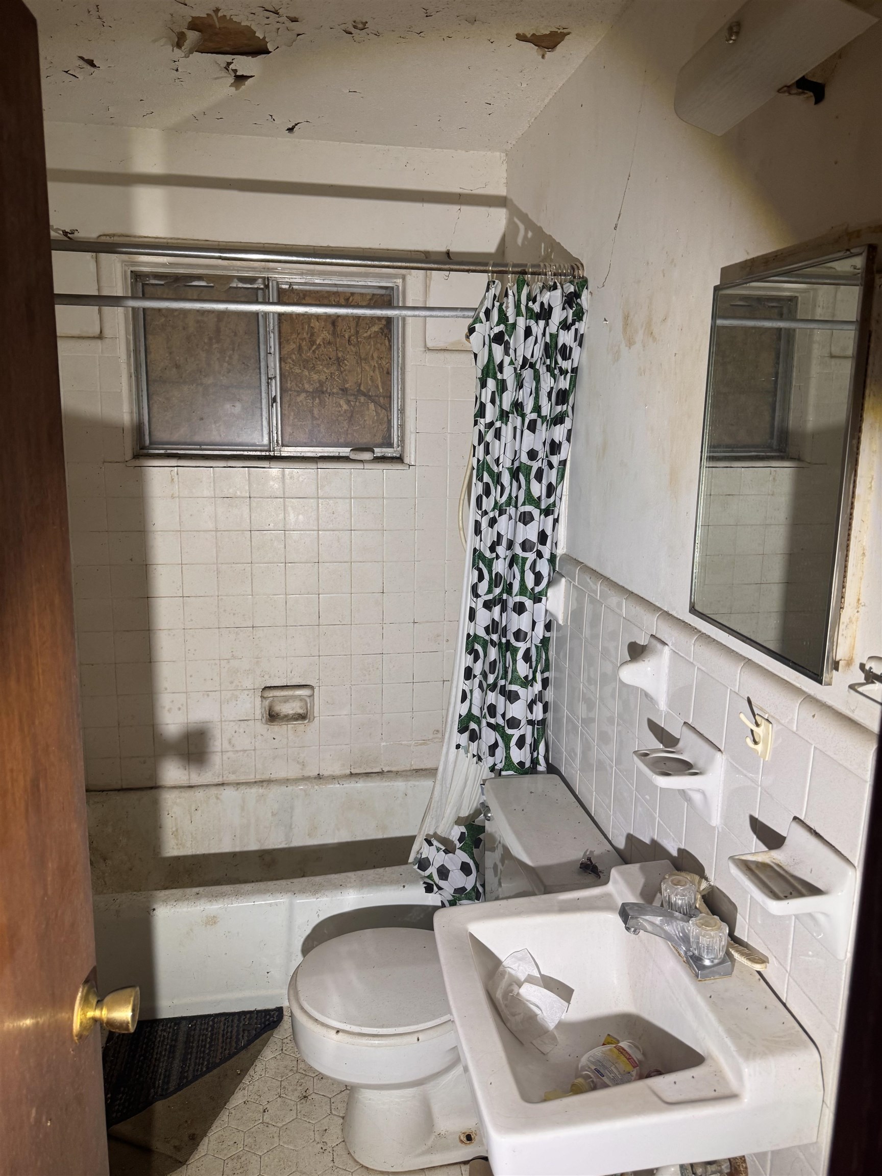 3251 Sinclair Street Memphis, TN 38127 - Photo 9 of 9 Full bathroom featuring shower / tub combo and tile walls
